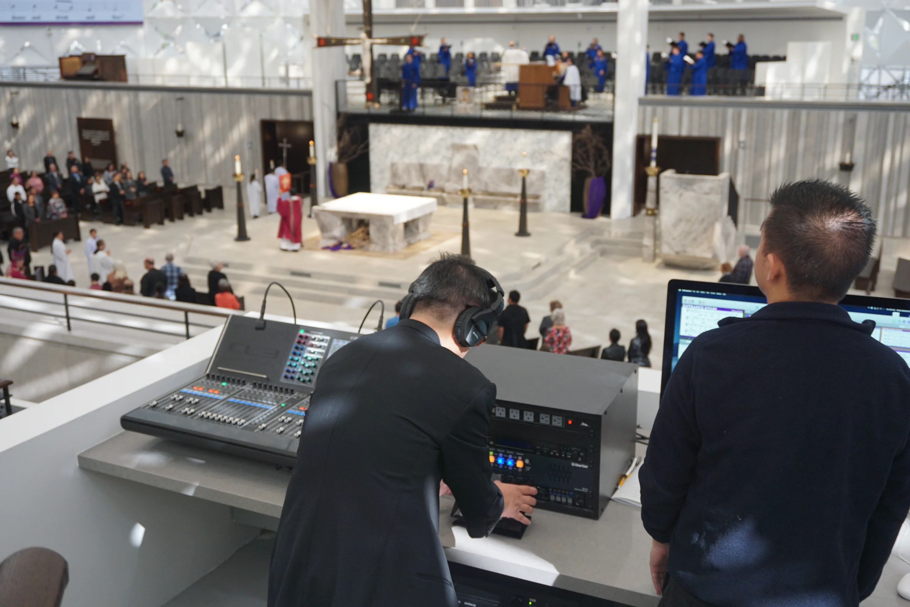 Audio and video crew running a Mass from the loft at Christ Cathedral